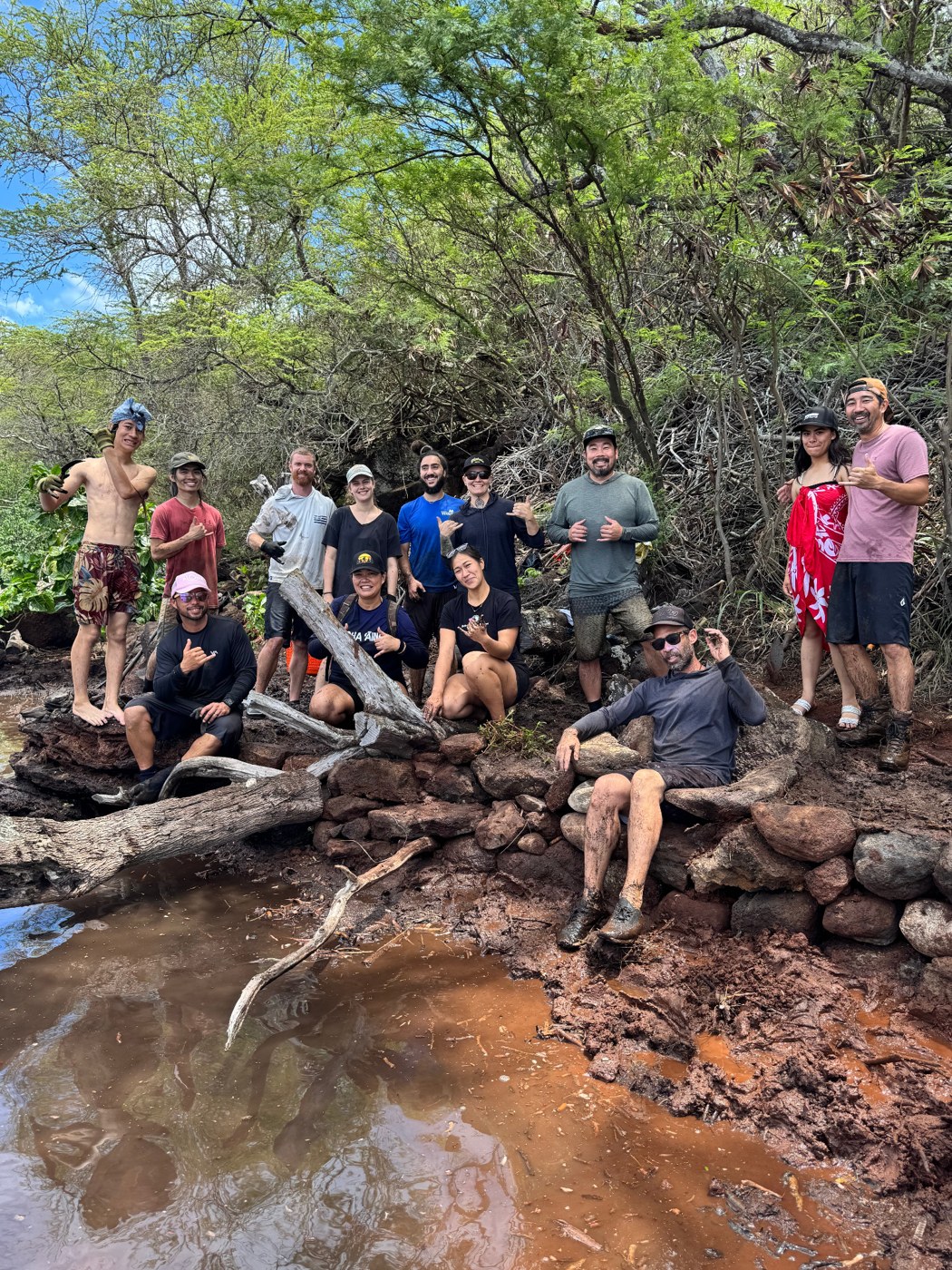 Restoration group beside the fishpond